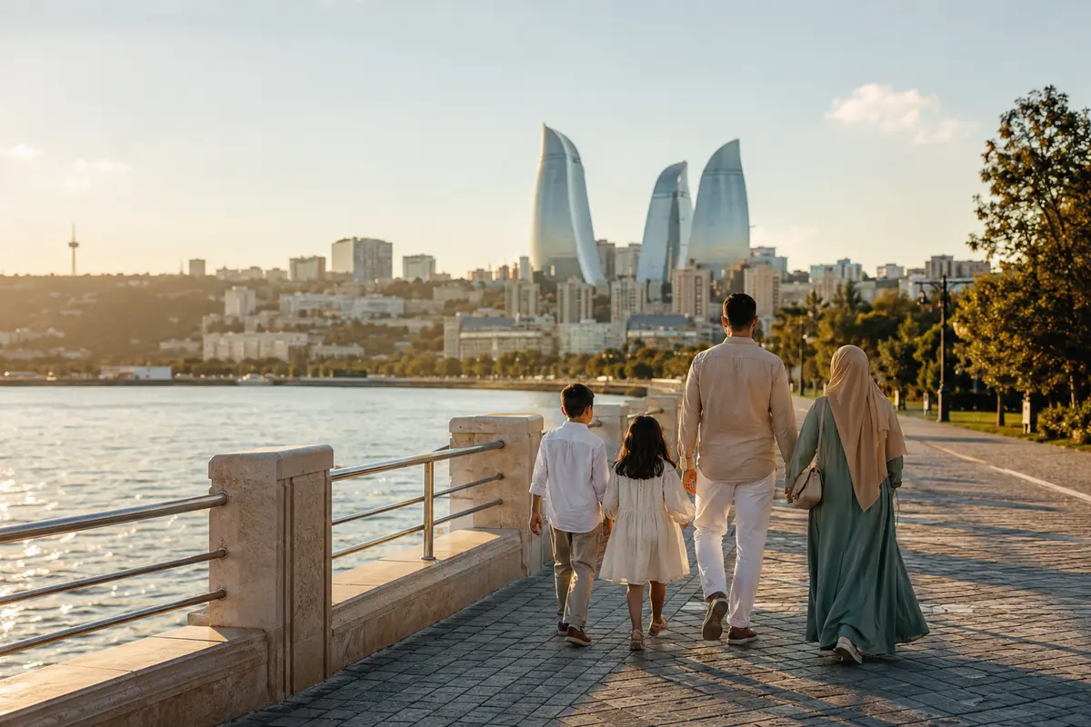 Family walking by the Baku waterfront with the Flame Towers in Azerbaijan